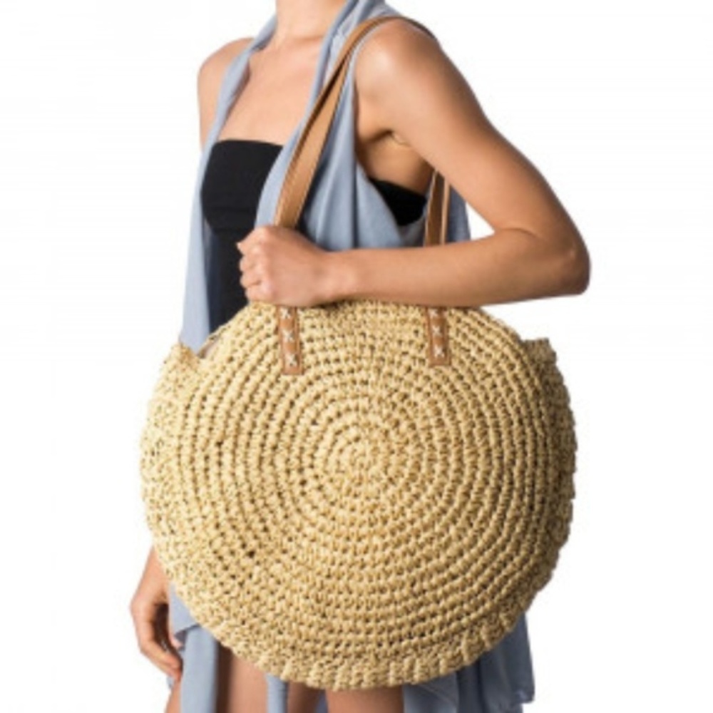 Straw circle bag with faux leather straps